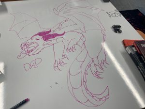 Drawing of a dragon on a whiteboard