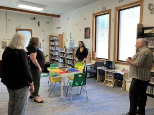 This image shows a group of adults in the kid's room at the Upper Skagit Library.